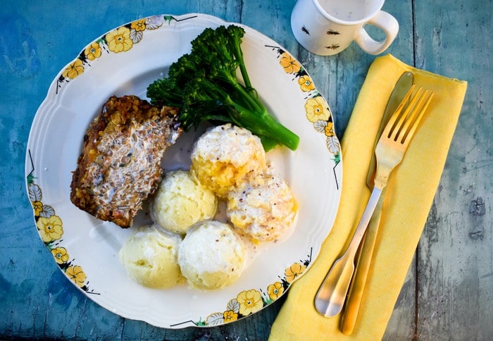 Vegan haggis, turnip, broccoli and mashed potatoes on a plate Vegan haggis, turnip, broccoli and mashed potatoes on a plate