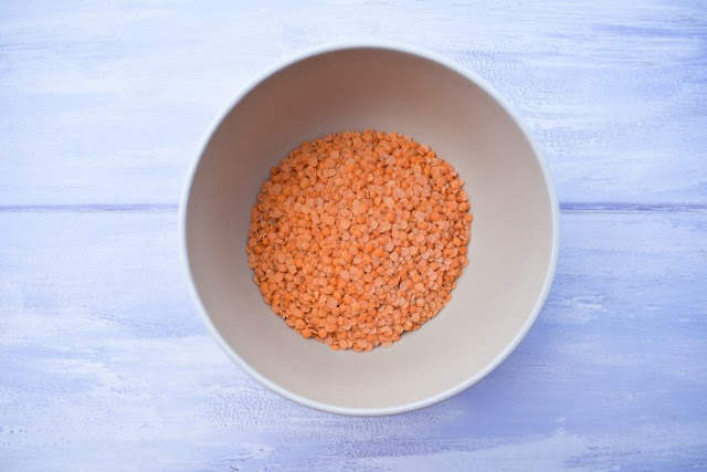 a small bowl of dry red lentils