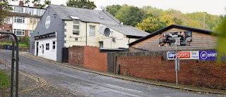 A panoramic view of The Blue Bell pub and Springbank Road