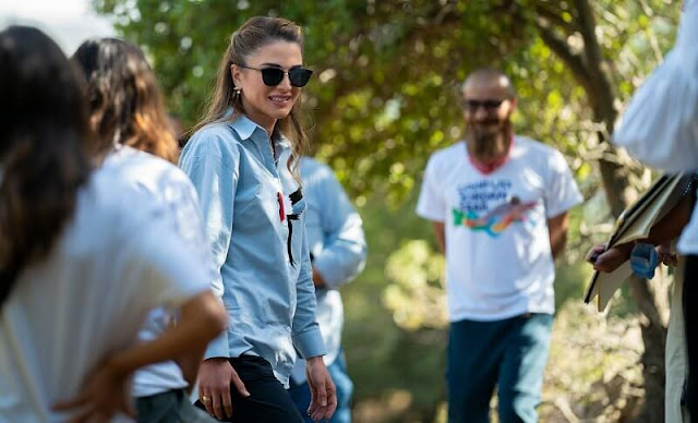 Queen wore her Salomon hiking shoes, Saint Laurent sunglasses and Nike pants, She wore a new embroidered blue shirt
