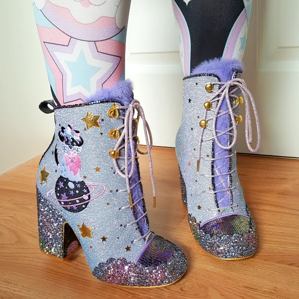 wearing lilac glitter heeled ankle boots with dog embroidery on side