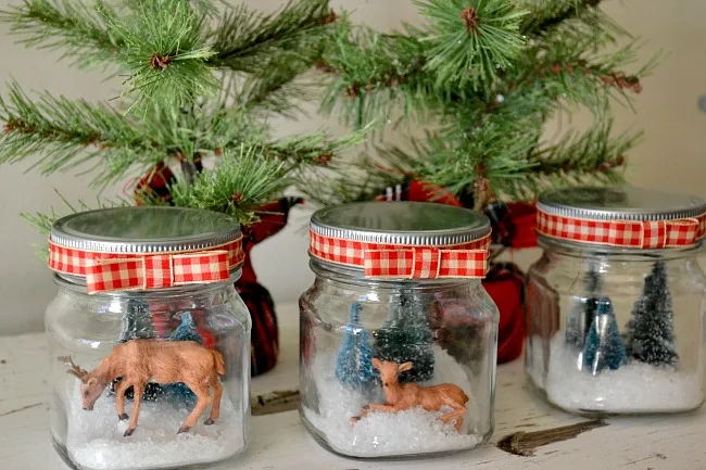 small glass jars with snow scene deer, trees, and deer. www.homeroad.net