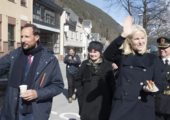 Crown Princess Mette-Marit wore Valentino coat and she wore Prada Brown Knee High Crocodile Boots. Telemark Rjukan-Notodden heritage site