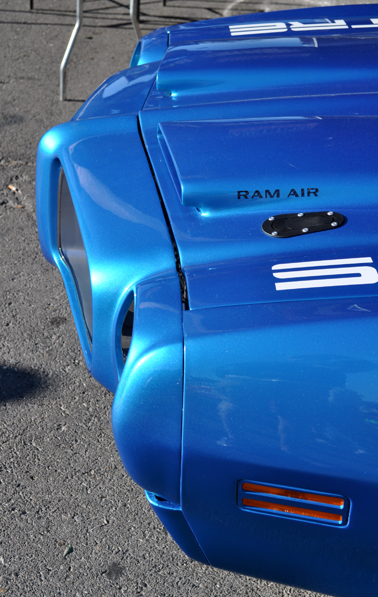 Just A Car Guy comparison of the hood scoops of a factoy hood scoop on