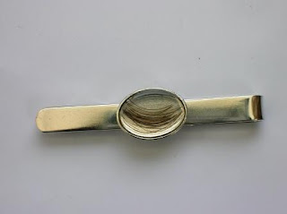 Sterling silver tie slide for a lock of hair