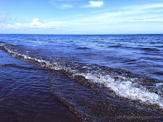 Rural Beach Water Waves On A Sunny Day Of Labuhan Aji Beach At Temukus Village, North Bali, Indonesia