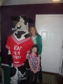 Taylor as the cow for Chick fil A