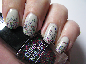 http://die-lackmamsell.blogspot.de/2014/01/topper-time-isadora-china-nail-art-hot.html