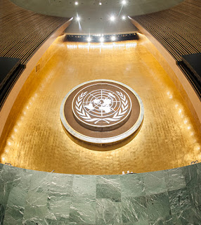 UN emblem and podium in the General Assembly Hall. UN Photo/Cia Pak