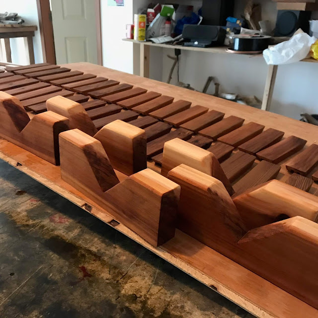 Fresh cut cedar drying after being oiled, at Coast Chimes