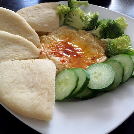 Hummus:  A creamy dip or spread made from chickpeas, tahini, lemon juice and olive oil.  Great with vegetables or pita.