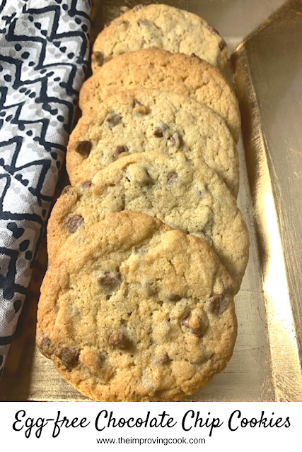 Egg Free chocolate chip cookies laid in a row on a gold plate