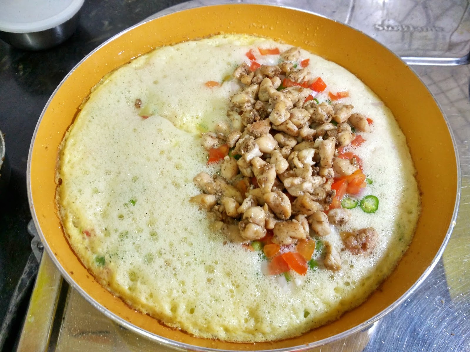 Cheesy Chicken filled Omelette Garlic Chicken Omelette Tempting Treat