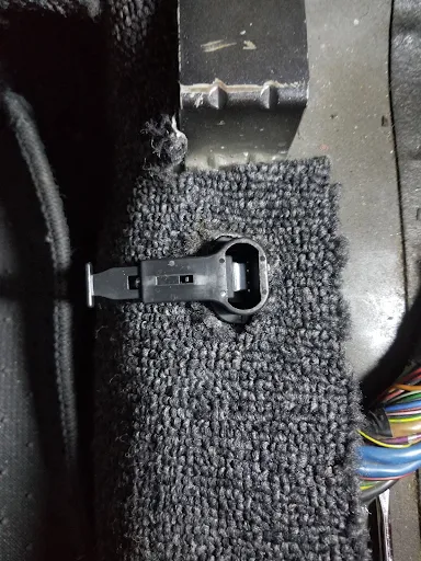Rear seat retainer replaced with spring loaded clip