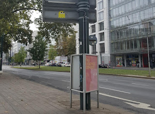 Pac-Man ghost sticker street art by Pdot in Düsseldorf, Germany