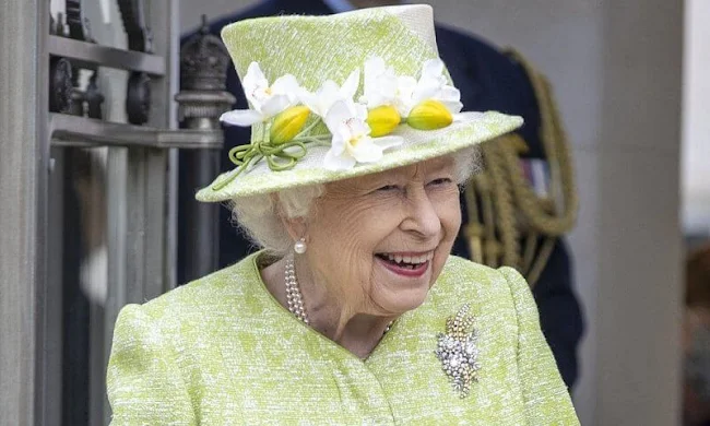 Queen Elizabeth, wearing a lime green coat and the Wattle brooch presented to her on first tour of Australia in 1954