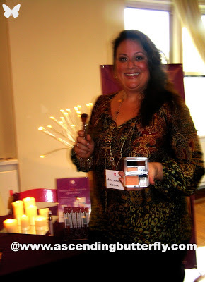 Andi from Mistura applies the 6-in1 Beauty Solution Pressed Powder during Beauty Press Spotlight Day at the Midtown Loft in New York City