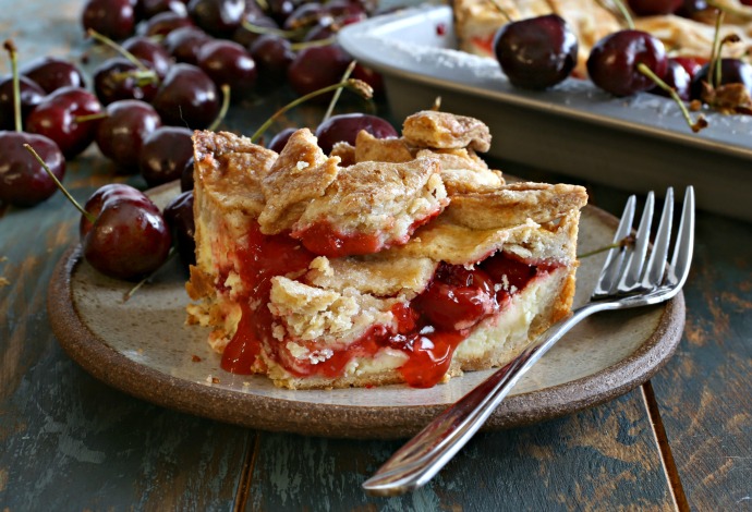 Recipe for pie with an almond cookie crust and cherry cheesecake filling.