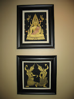 Golden Buddha has beautiful pictures on the wall