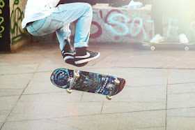 Young man doing a skateboard trick, playing HORSE, challenge