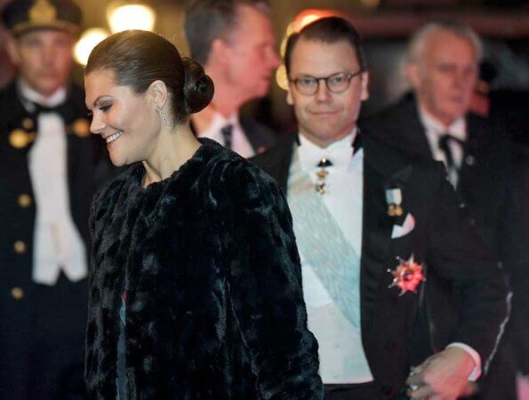 Queen Silvia and Prince Daniel. Crown Princess Victoria wore Filippa K faux fur jacket. burgundy. red velvet dress. Princess Madeleine