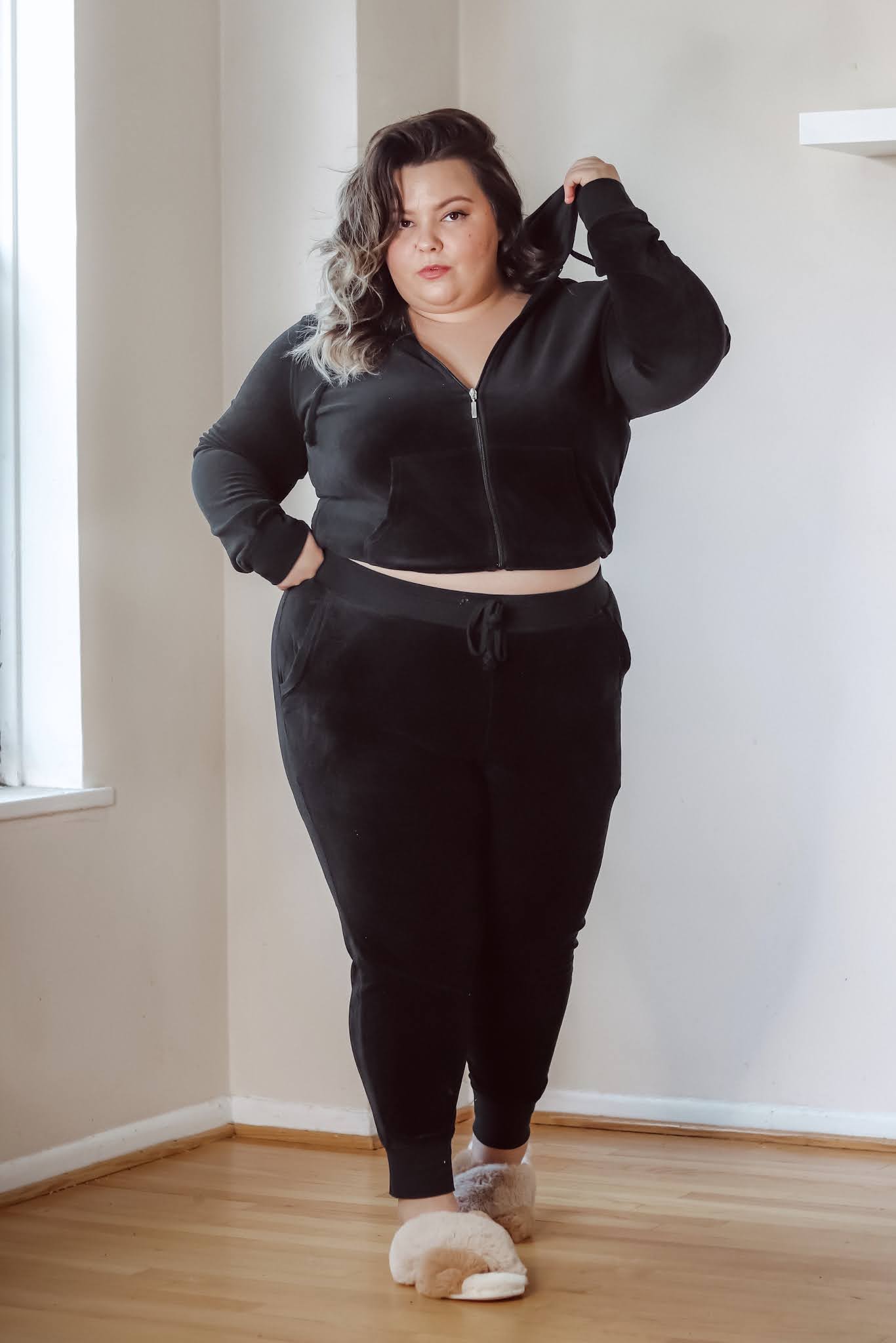 Chicago Plus Size Petite Fashion Blogger Natalie in the City wears a plus size velour tracksuit from Fashion Nova and Juicy Couture.