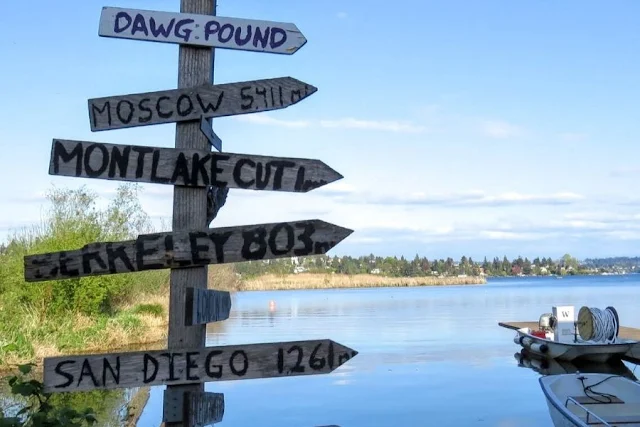 Seattle in a day:  wooden arrows pointing to places at Union Bay Natural Area