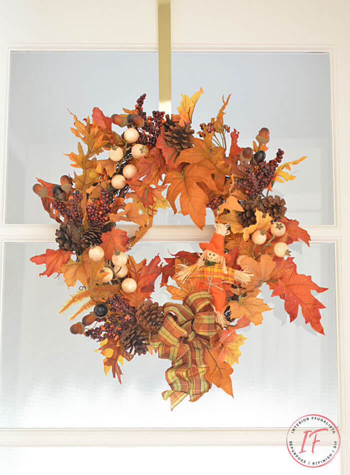 Easy no brainer DIY Fall wreath made with recycled garlands and seasonal picks from old wreaths you've grown tired of. A budget fall decorating idea.