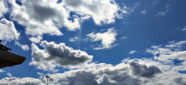 The sky with fluffy white clouds