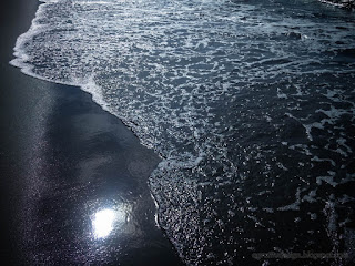Bubble Of Sea Wave On Black Beach Sand In A Sunny Day At The Village North Bali Indonesia