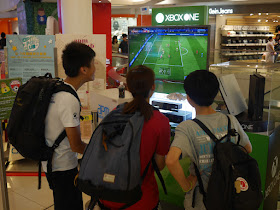playing soccer on XBOX at apm Hong Kong