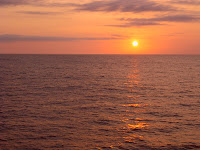 There's a dolphin in this photo somewhere - can you spot it? Sunset & dolphins on the high seas