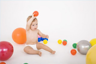 Baby developing ball skills