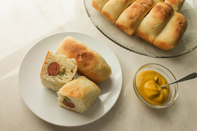 Food Lust People Love: These sausage jalapeño cheese kolaches are best made with quality beef franks, sliced fresh jalapeños and sharp cheese. They are the perfect filling for the soft, slightly sweet dough that surrounds them. This dough is a bit different from the one I made to fill with sweet apricots. It’s a little less enriched – no sour cream, for one – with a little less sugar per kolache. I adapted this recipe from one on The Brewer and the Baker.