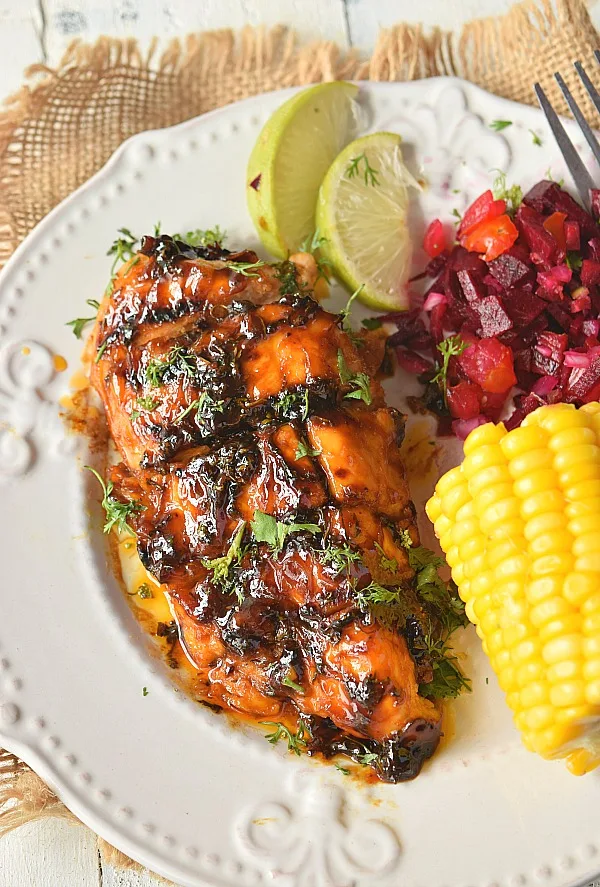 easy cilantro lime chicken served on a plate,grilled and sliced