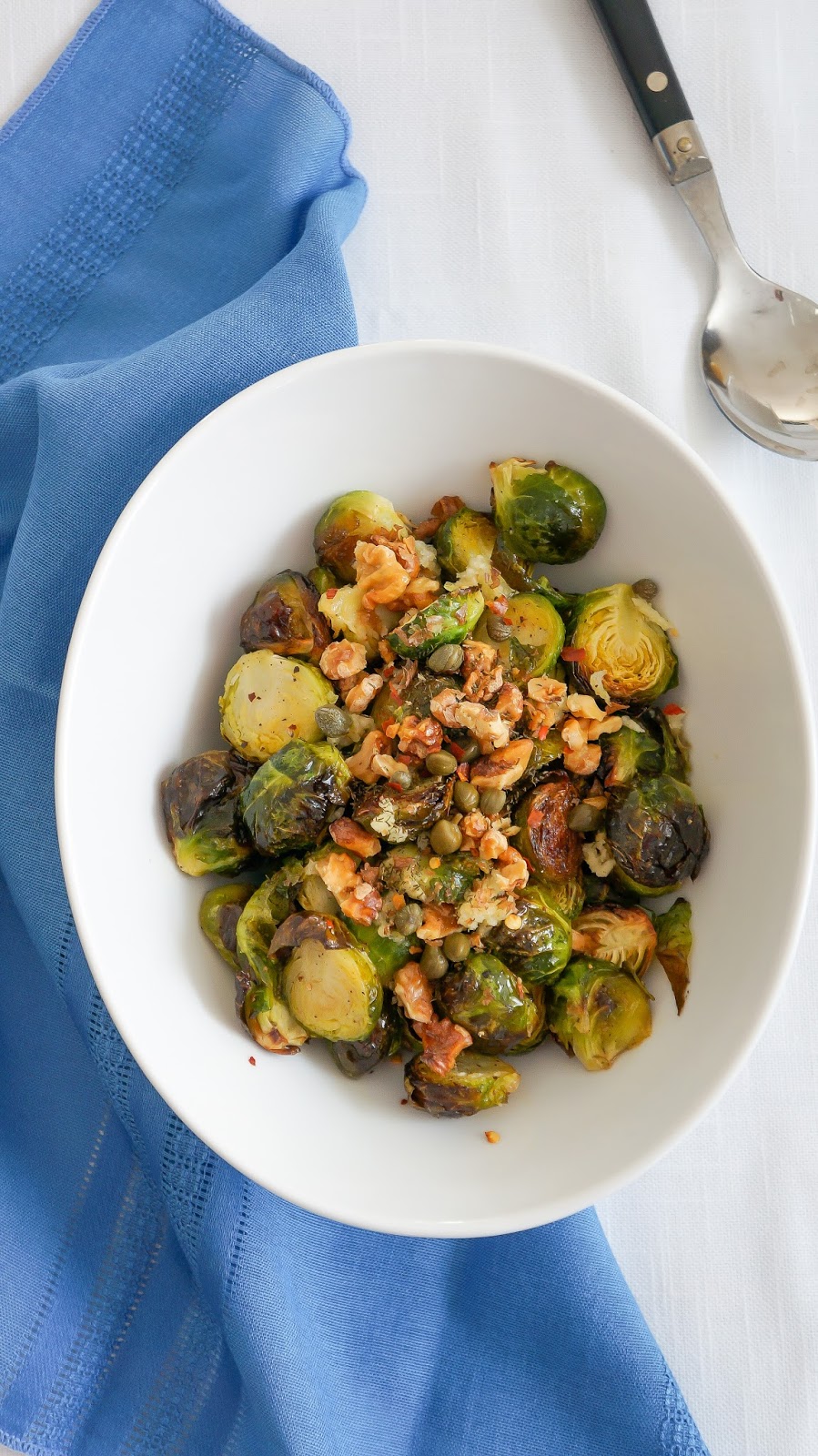 Roasted Brussels sprouts salad with toasted walnuts, capers and dill