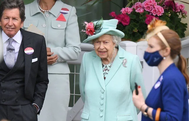 Queen Elizabeth wore an aquamarine coloured coat and dress and a matching hat adorned with pink flowers. Palm Leaf brooch