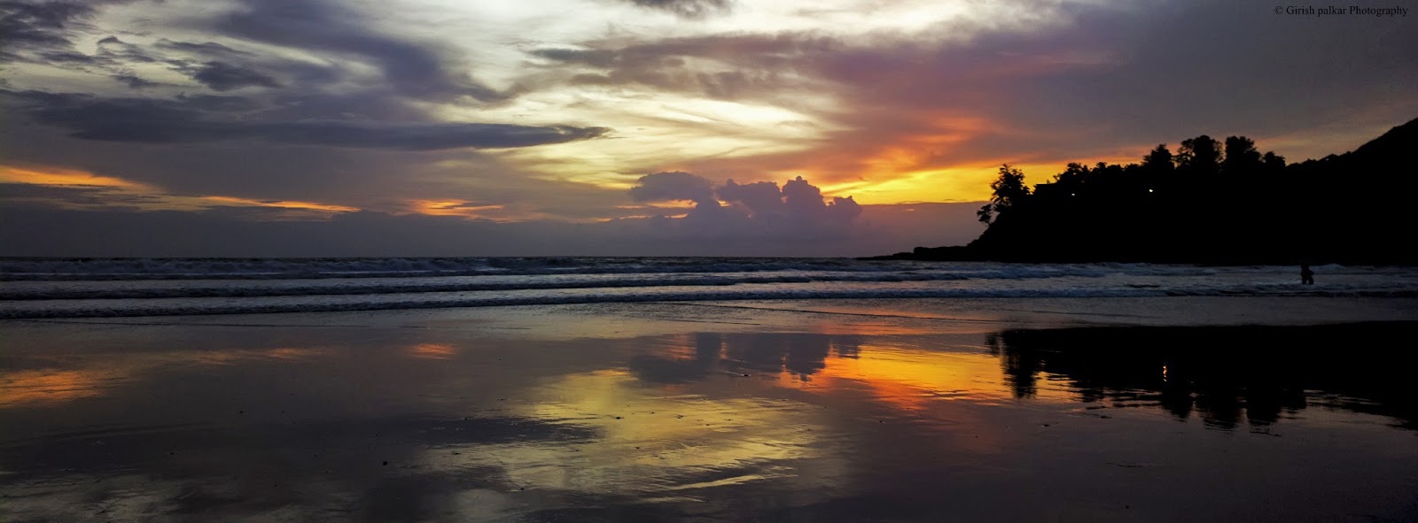 a sunset over a beach