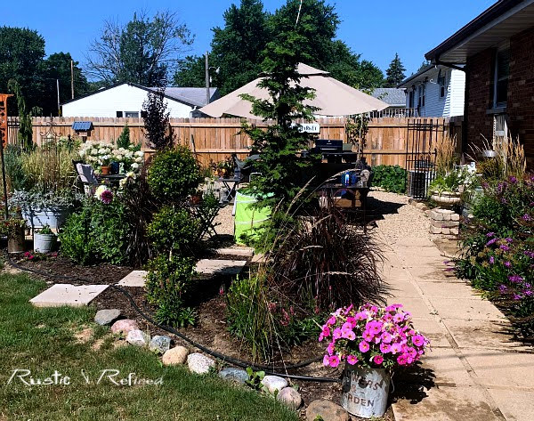 Backyard patio and garden tour in a beautiful Indiana garden with gorgeous year round color.