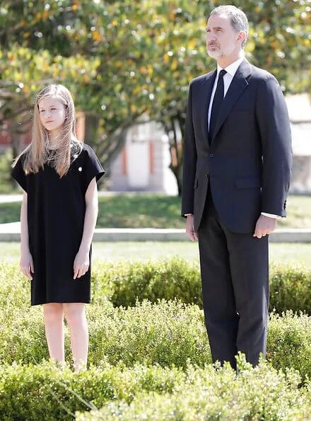 King Felipe, Queen Letizia, Princess Leonor and Infanta Sofia observed a minute's silence for victims of the coronavirus. Felipe Varela dress