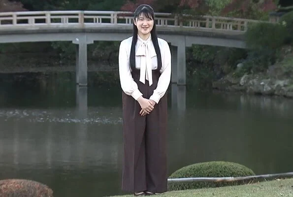 Japanese Princess Aiko wore a pink pussy-bow silk blouse. Princess Aiko with her dog Yuri at Akasaka