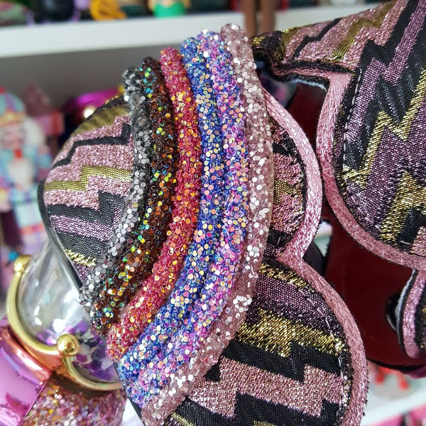 close up of layered glitter section at heel of shoe