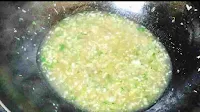 Cooking lemon coriander soup in a wok