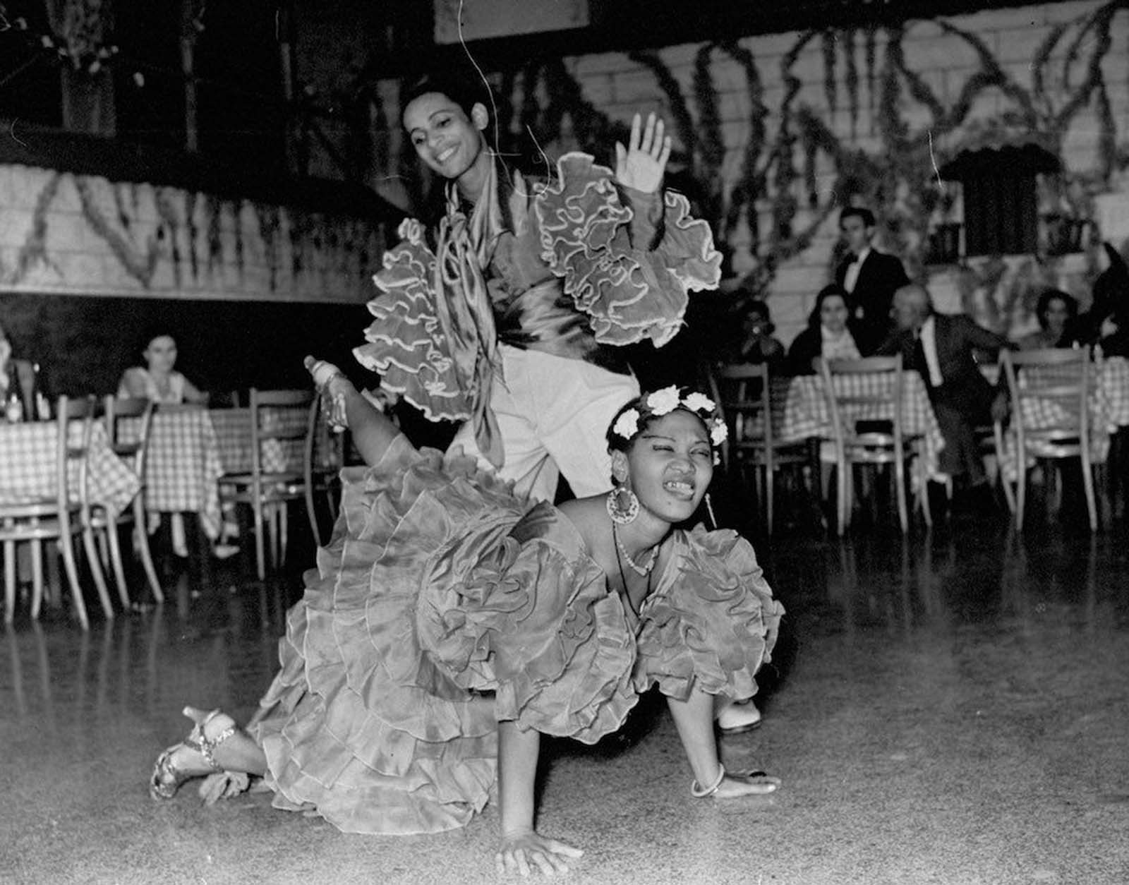 A view of people dancing at a Cuban club. 1937.