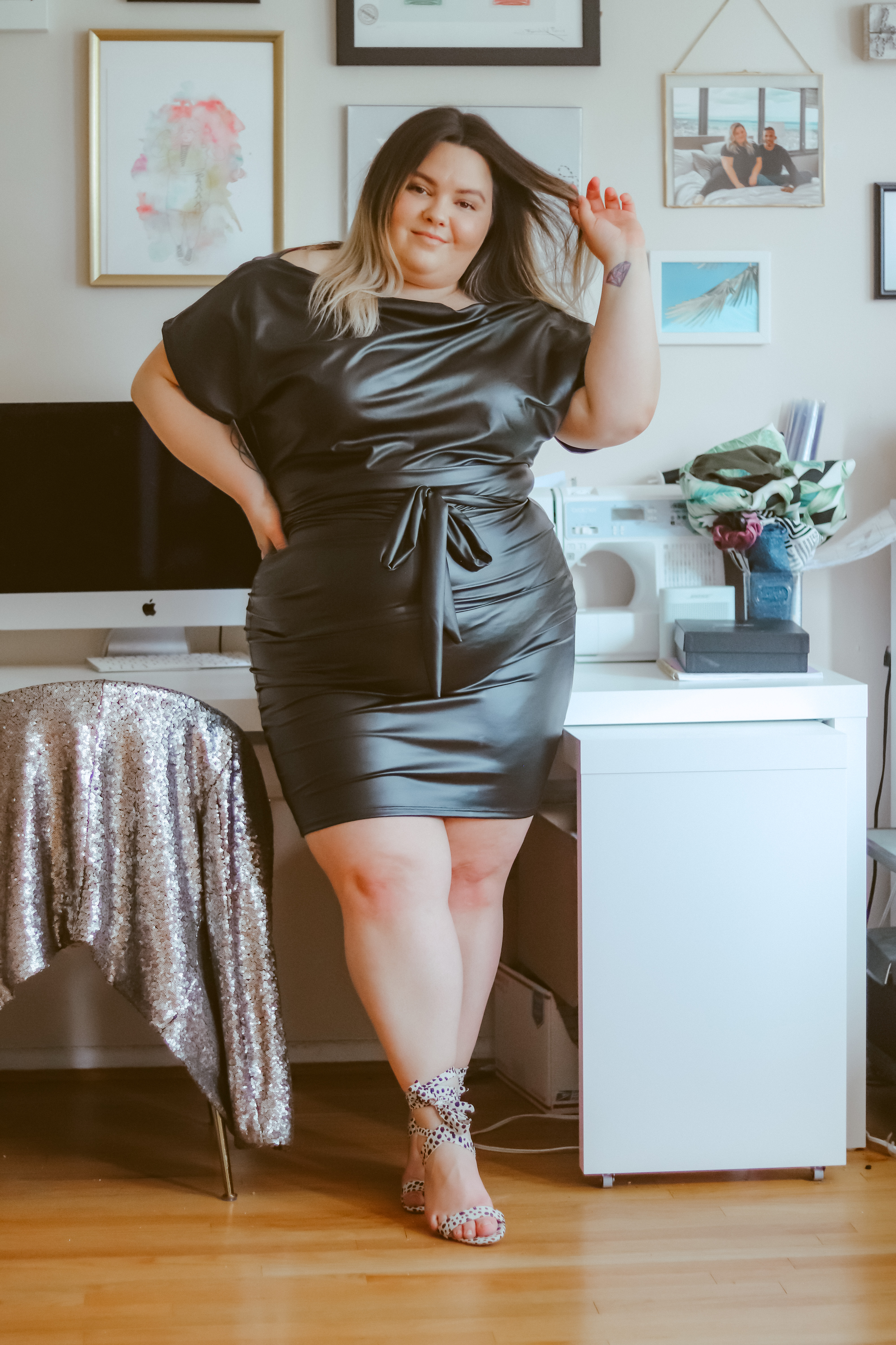 Chicago plus size fashion blogger Natalie in the City wears a faux leather midi dress