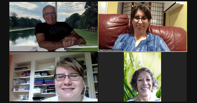 A screenshot of four people in an online call