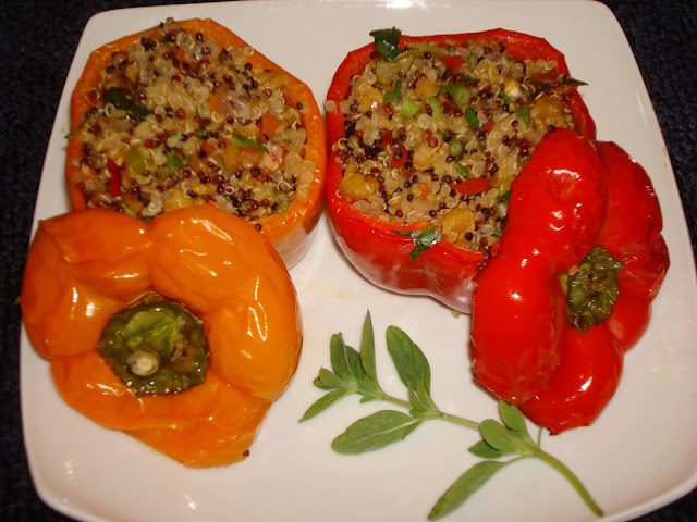PORTIONS: 4 1 PORTION = 125 CALORIES INGREDIENTS 4 bell peppers any color ½ cup three colors quinoa 1 cup water ½ tsp. salt 1 tbsp. olive oil 1 diced shallot 1 minced garlic clove 1/3 cup diced orange pepper 1/3 cup diced red pepper 2 tbsp. raisins ¼ cup chopped walnuts 1 tbsp. chopped parsley METHOD In a small pot boil the water with salt. Stir in the quinoa, cover and let it simmer for 17 minutes. Turn off the heat. Let it stand for 10 minutes. Heat the olive oil in a frying pan and sauté shallots and garlic for 1minute. Add peppers, raisins, walnuts and cook for 2 more minutes. Stir in the cooked quinoa and serve. Slice off top of the peppers and remove the seeds. Slice at bottom of the pepper so it will stand up. Brush the peppers and the top with oil. Spoon the quinoa mixture into the hollowed peppers. Cover with the tops and arrange them in a baking dish. Preheat the oven at 450° F.  Bake the peppers for about 15 minutes and serve.