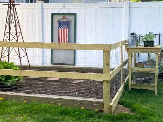 Pressure treated lumber garden fence