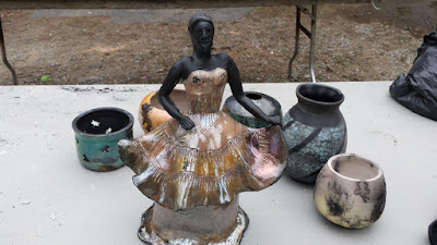 Raku fired pottery sculpture with glazed and unglazed areas.