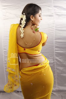 Hot Anushka Shetty in yellow saree showing Her Big Butts